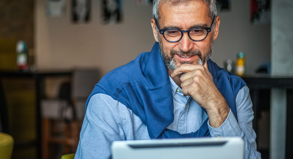 image of a man using a tablet