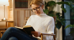 woman sitting reading a book