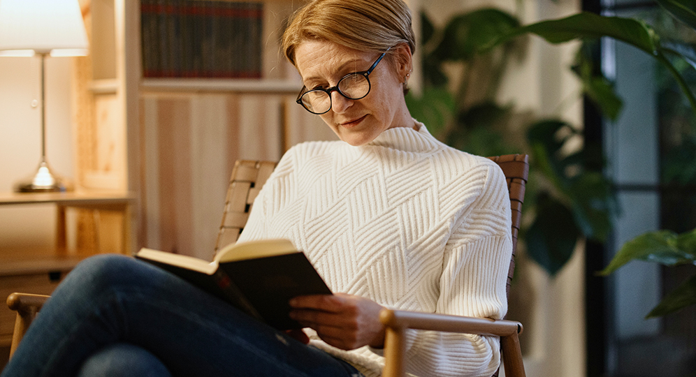 woman sitting reading a book