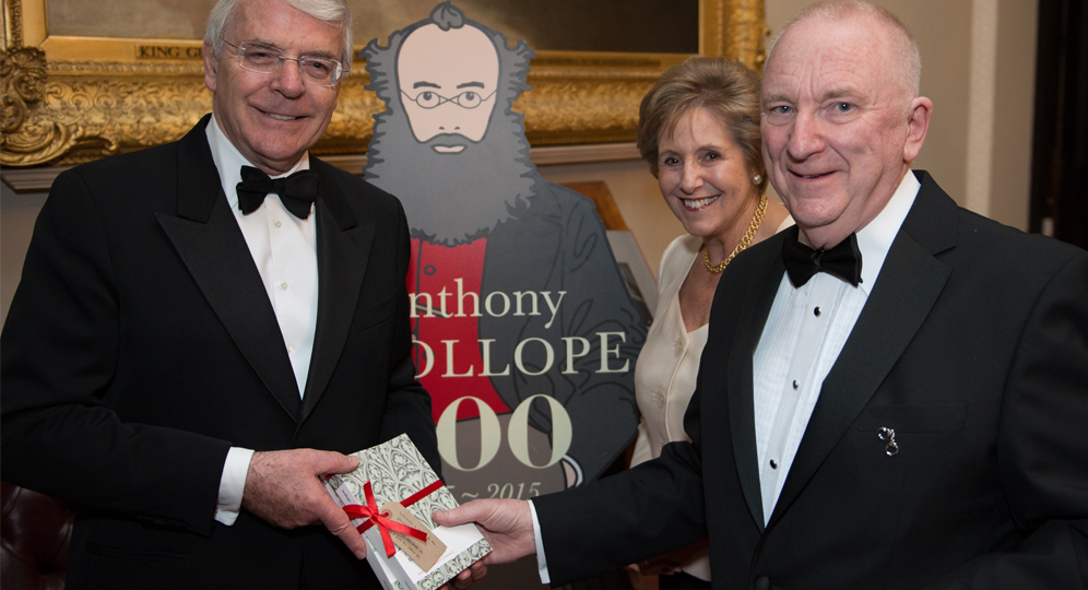 Michael Williamson presents Sir John Majopr with a copy of Barchester Towers